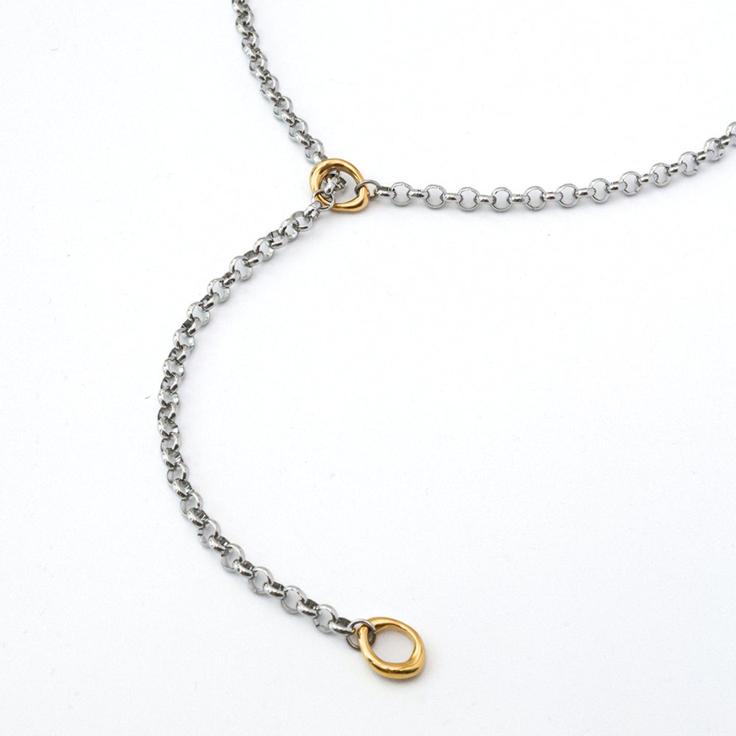 Necklace with gold and silver chain links on a white background