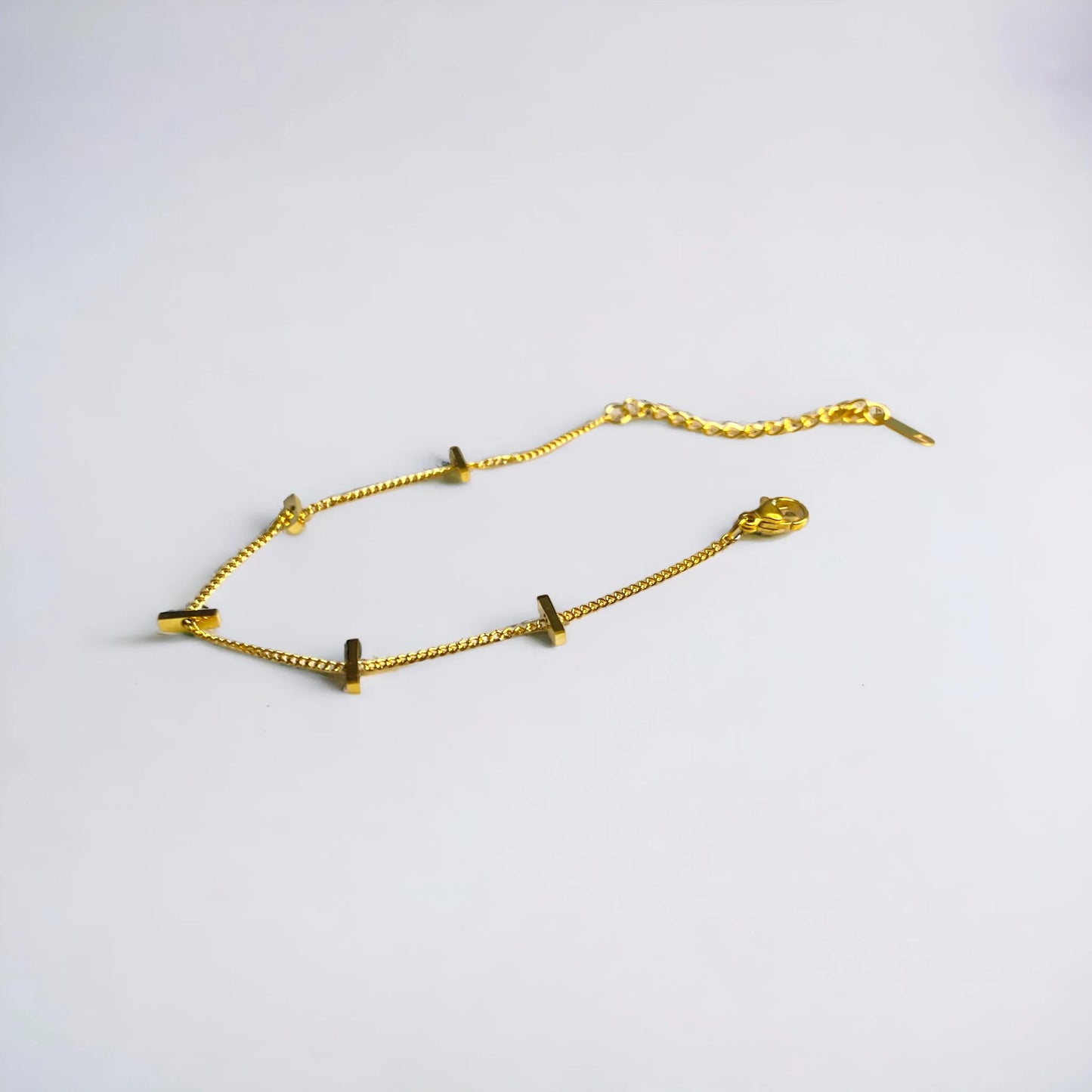 Thin minimalist gold bracelet with small bars