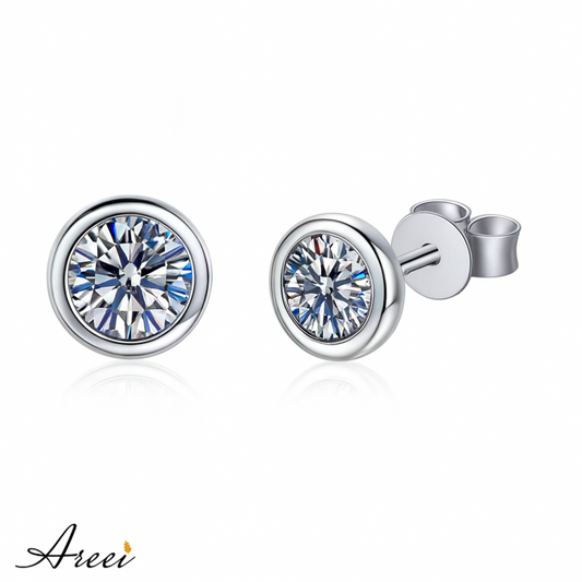 Silver stud earrings with clear gemstones on a white background, featuring the brand 'Areei'.