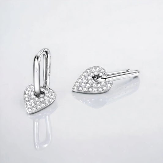 Silver huggie earring with dangling heart zirconia