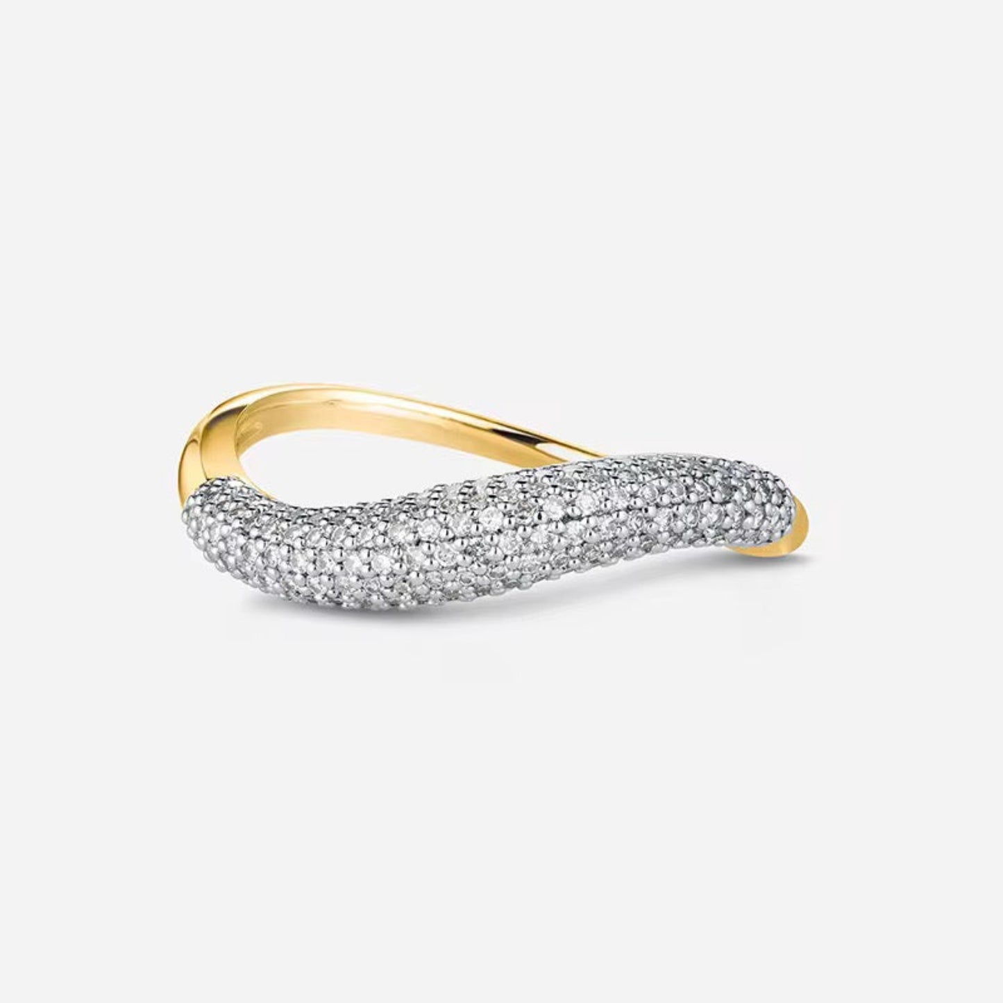 Gold and silver ring on a light gray background