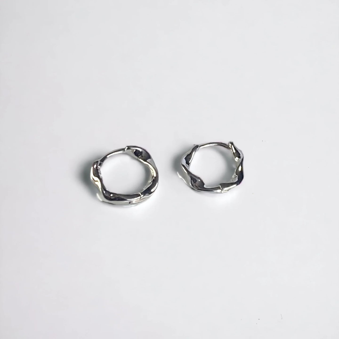 Silver micro huggie earrings