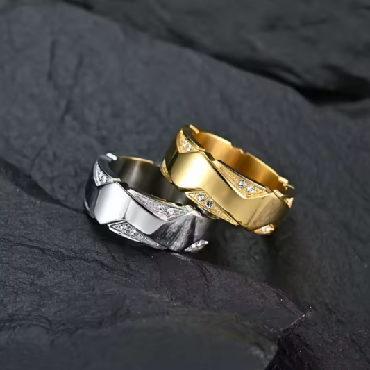 Gold and silver rings on a dark stone surface