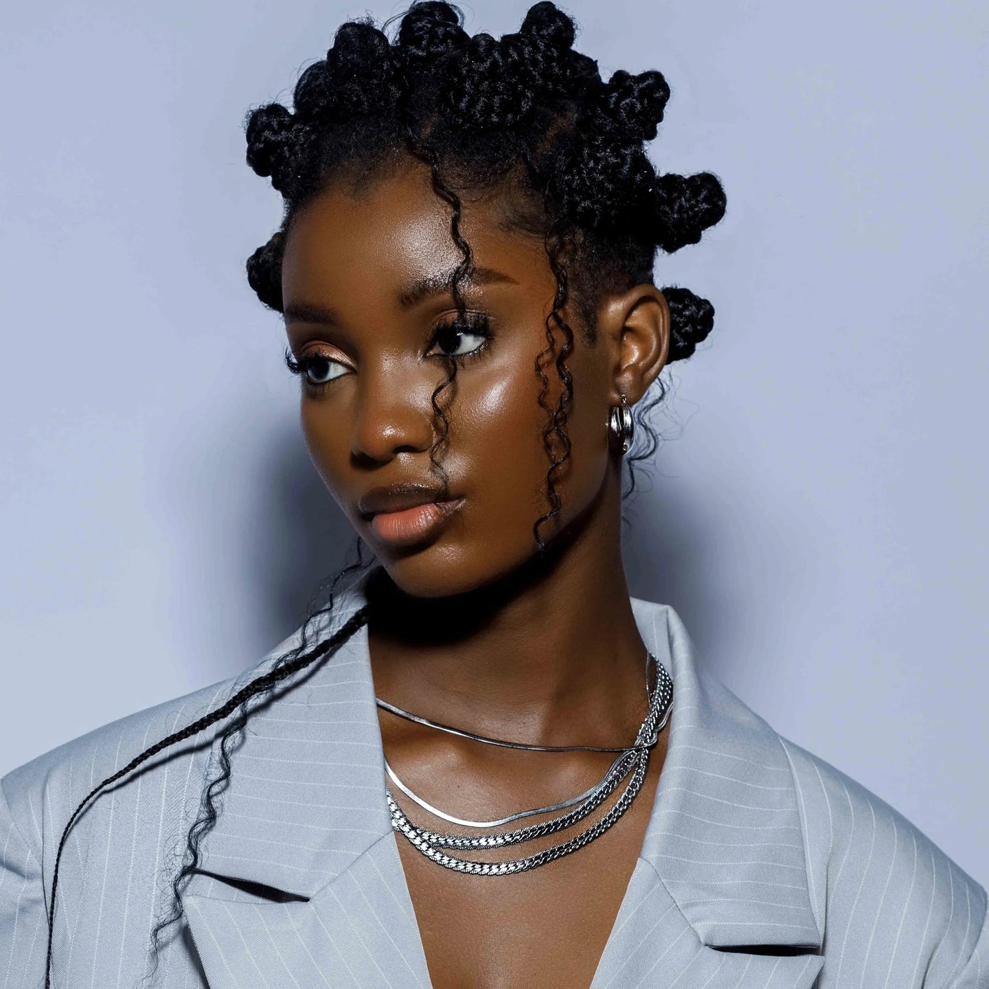 Black girl in bantu knots in silver cuban chain